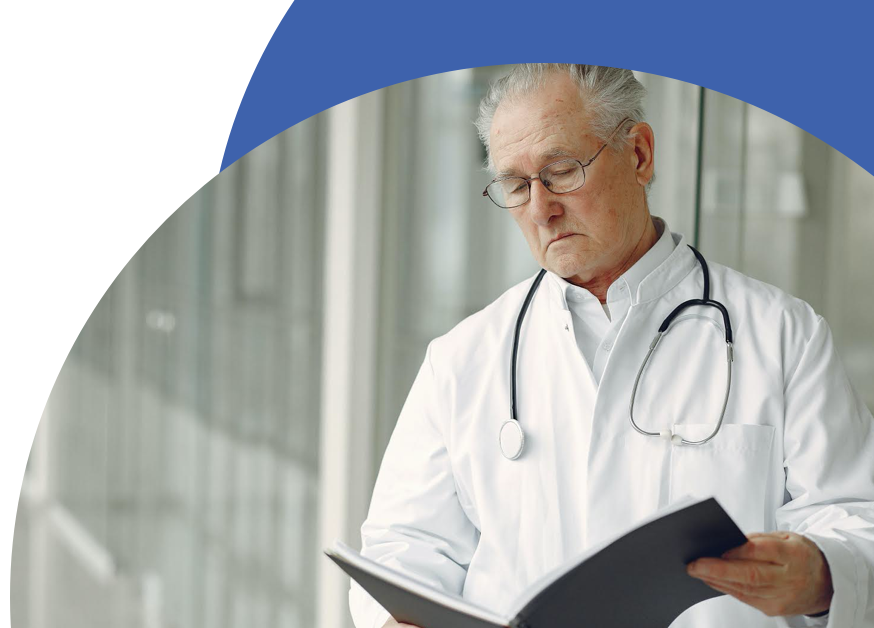 Contemplative doctor in uniform reading clinical records