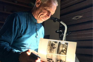 Man in recovery looking through an old book