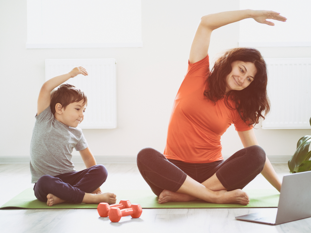 A mother and son doing yoga together