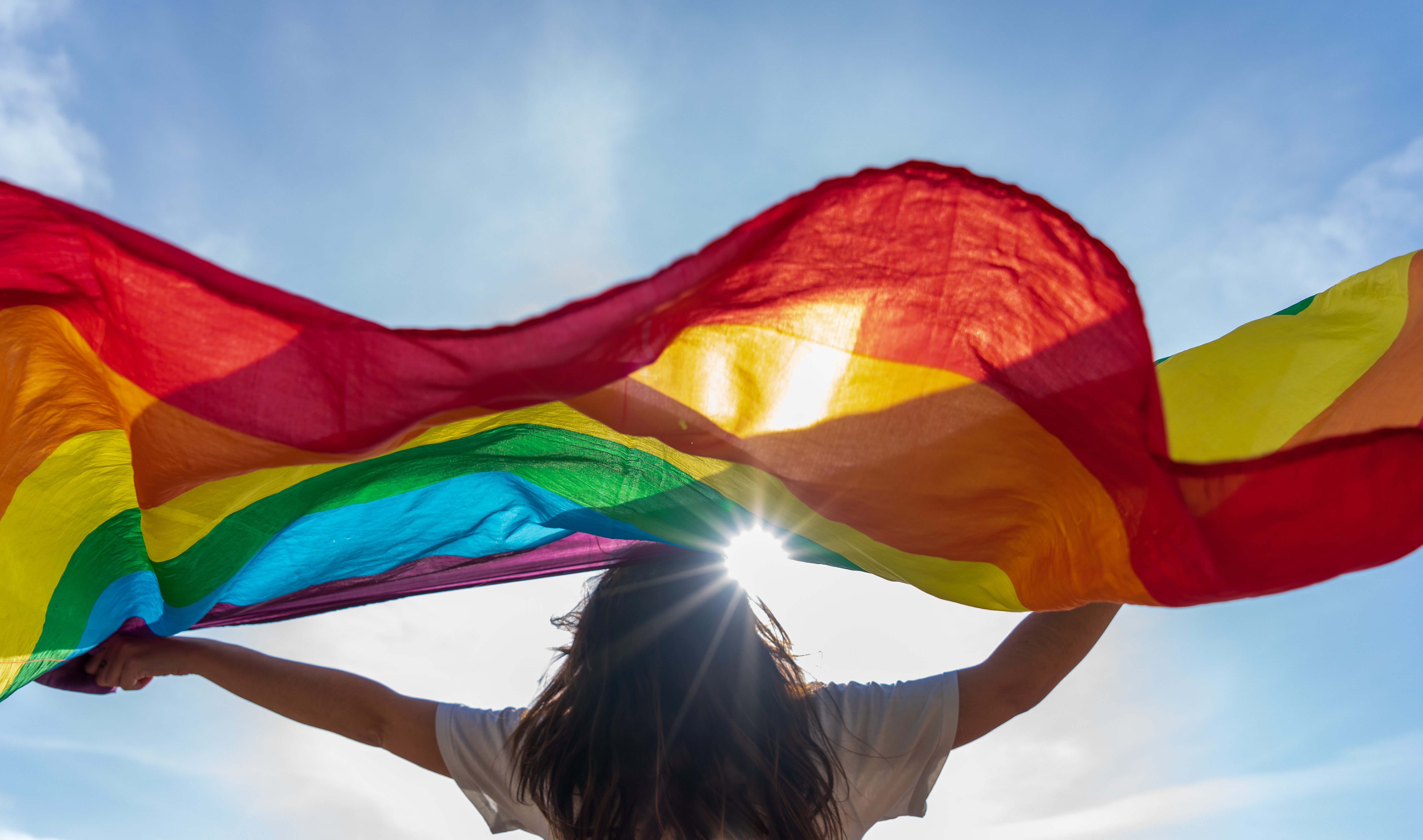 woman holding pride flag