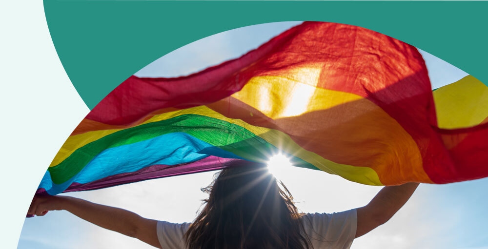 Woman holding a pride flag