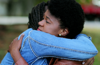 Two people hugging