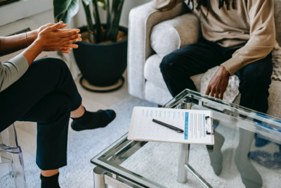 Two people discussing treatment