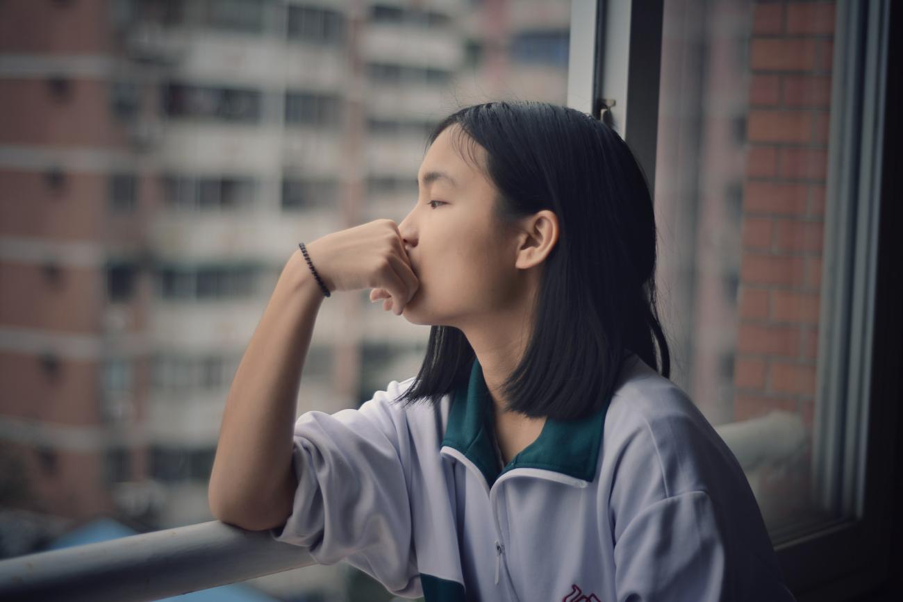 Woman sitting at window