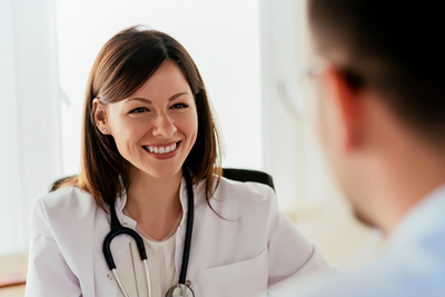 A nurse smiling at a patient