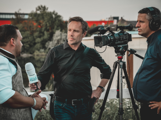 Reporters filming nightly news