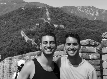 A black and white photo of the Tarica brothers on the Great Wall of China