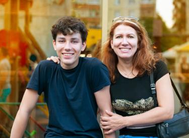 Woman with red hair and her teenage son