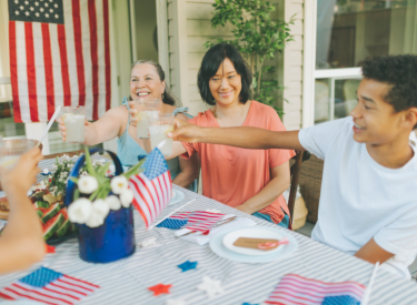 Friends at a table during 4th of July