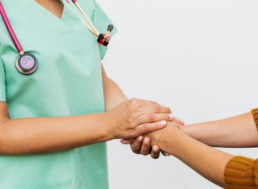 Provider holding hands