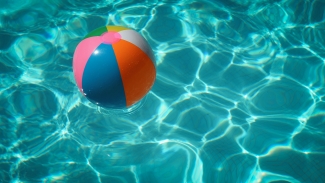 A beach ball floating in a pool